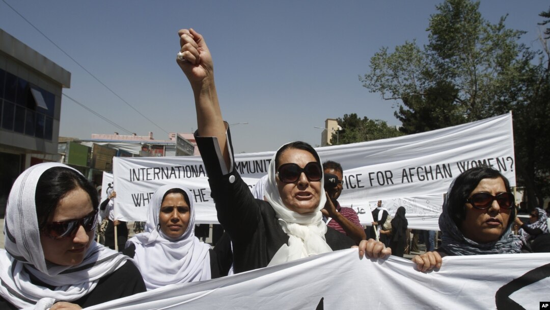 An Afghan protestor shouts slogans during a demonstration in support of female victims of abuse and violence in Kabul, Afghanistan, July 11, 2012.