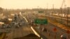 FILE - Cars and trucks roll along a section of Highway 99 during rush hour in Fresno, Calif., June 23, 2017. California's vast San Joaquin Valley has long been burdened by some of the nation's dirtiest air. 