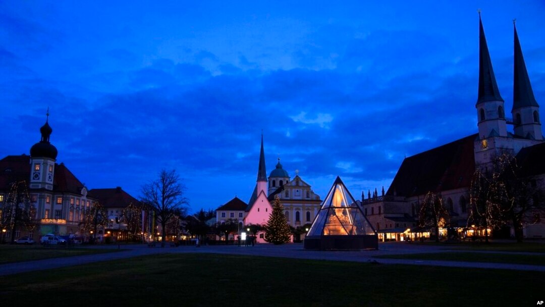 The main square is illuminated in Altoetting, some 90 kilometers east of Munich near Marktl, the birthplace of Pope emeritus Benedict XVI, Germany, Dec. 29, 2022.