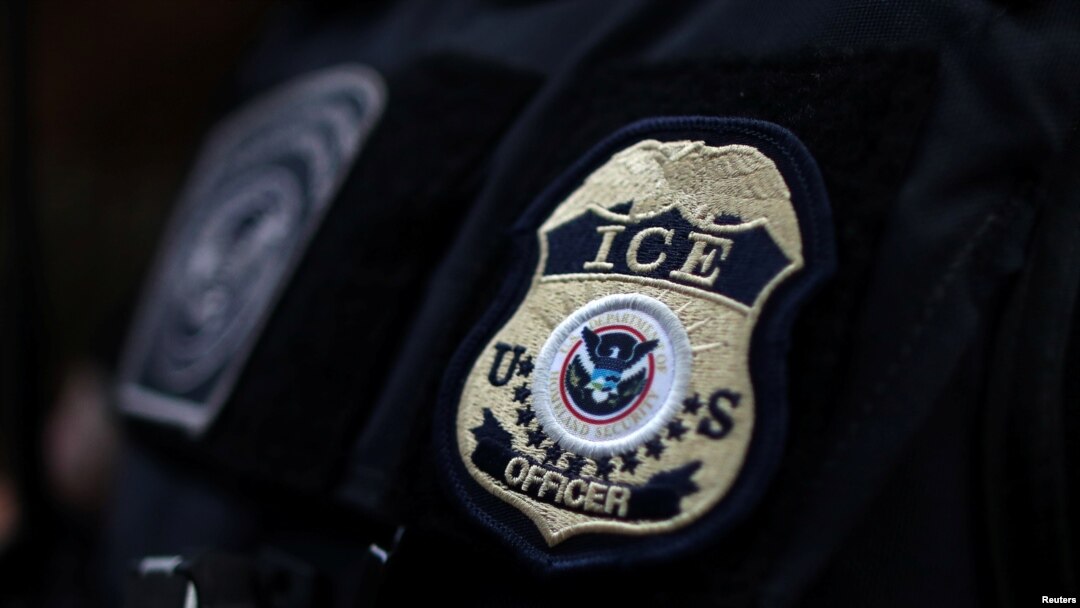 FILE - The badge of a field office director for the U.S. Immigration and Customs Enforcement's (ICE) Enforcement and Removal Operations in Hawthorne, California, on March 1, 2020.
