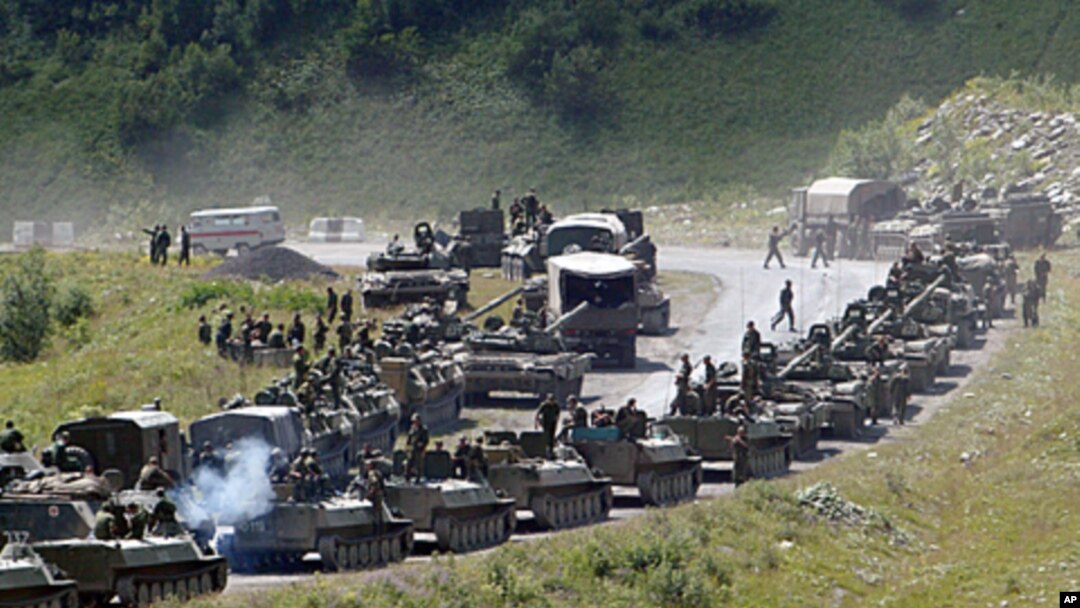 A column of Russian armored vehicles on its way to the South Ossetian capital Tskhinvali in the Georgian breakaway region, South Ossetia, August 9, 2008 file photo
