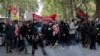 Demonstrators hold a banner reading : "Proletarians and oppressed peoples of all countries, unite" during a May Day demonstration march from Republique, Bastille to Nation, in Paris, France, May 1, 2022. 