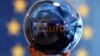 FILE - A person adjusts an EU decoration ball at the European Commission delegation building in Sofia, Bulgaria.