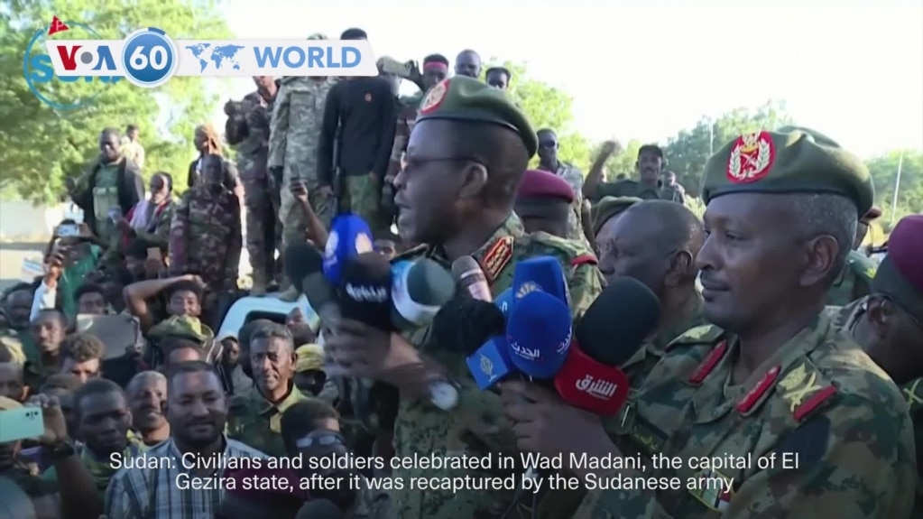 VOA60 World - Civilians and soldiers celebrate recapture of Wad Madani by Sudanese military