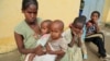Tsegy Kiday, a 34-year-old displaced single mother, is seen with her five children in Nebelet, Tigray region, Ethiopia, July 11, 2021.