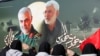 FILE - Iraqi women gather at the scene where Iran's Quds Force top commander Qassem Soleimani and Iraqi militia commander Abu Mahdi al-Muhandis were killed in a U.S. airstrike at Baghdad airport, Iraq, Feb. 13, 2020.