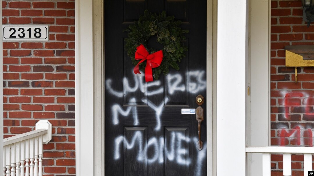 Graffiti is seen on a door of the home of Senate Majority Leader Mitch McConnell, R-Ky., in Louisville, Ky., on Jan. 2, 2021.