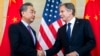 FILE - U.S. Secretary of State Antony Blinken, right, shakes hands with then-China's Foreign Minister Wang Yi during a meeting in Nusa Dua on the Indonesian resort island of Bali, July 9, 2022.