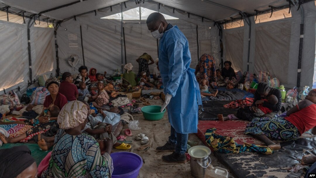 FILE - Doctor Robert Musole, medical director of the Kavumu hospital, visits patients recovering from mpox in the village of Kavumu, 30 kilometers north of Bukavu in eastern Democratic Republic of Congo on Aug. 24, 2024.