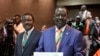 Orange Democratic Party, ODM, presidential candidate, Raila Odinga, right, displays his registration certificate, with running mate Vice President Kalonzo Musyoka, left, in Nairobi, Kenya, Jan. 30. 2013. 