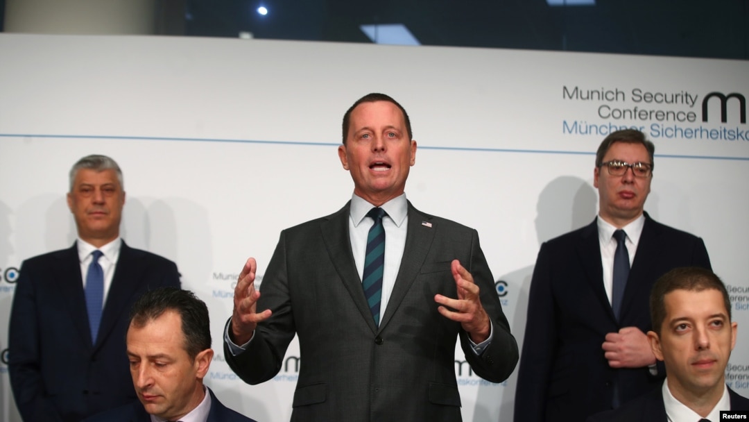 Richard Grenell, center, U.S. special envoy to Belgrade-Pristina talks; Kosovo's President Hashim Thaci, standing left; and Serbia's President Aleksandar Vucic, standing right, attend the Munich Security Conference in Germany, Feb. 14, 2020.
