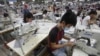 FILE - Laborers work at a garment factory in Bac Giang province, near Hanoi, Vietnam, Oct. 21, 2015. 