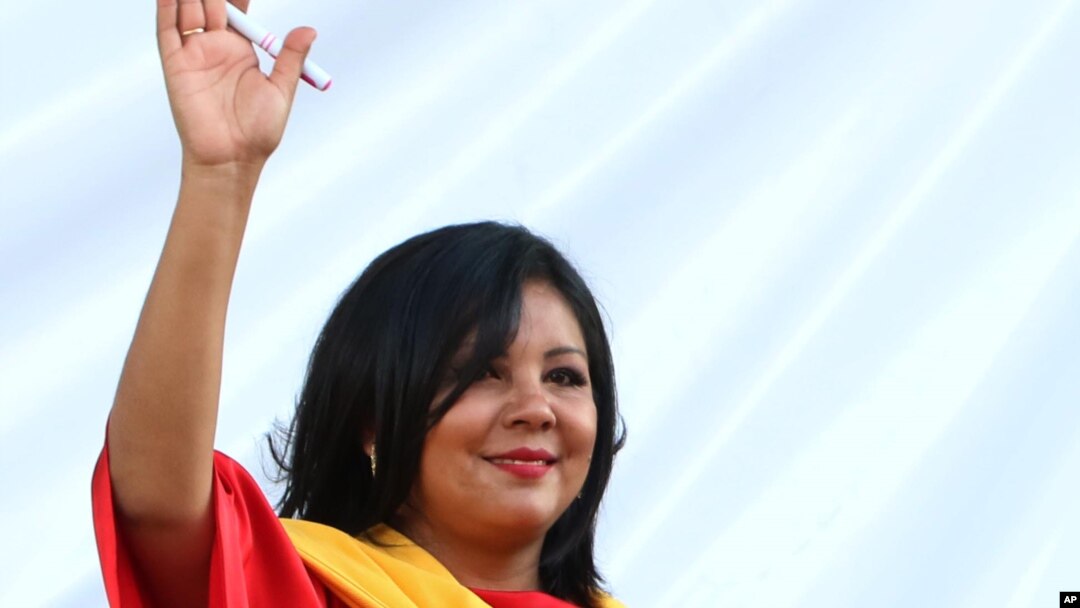 Gisela Mota waves during her swearing in ceremony as mayor of Temixco, Morelos State, Mexico, Jan. 1, 2016. 