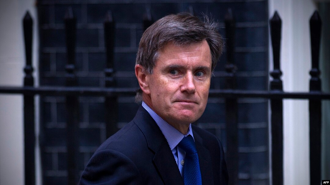 FILE - John Sawers, then chief of Britain's foreign intelligence service MI6, arrives at Downing Street ahead of a meeting of the National Security Council, in central London, Aug. 28, 2013.