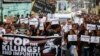 Protesters and supporters carry banners and placards as they march with the hearse of slain Kian Loyd Delos Santos, a 17-year-old student, during his funeral, Aug. 26, 2017, in suburban Caloocan city north of Manila, Philippines. The killing of Kian has sparked an outcry against President Rodrigo Duterte's anti-drug crackdown.