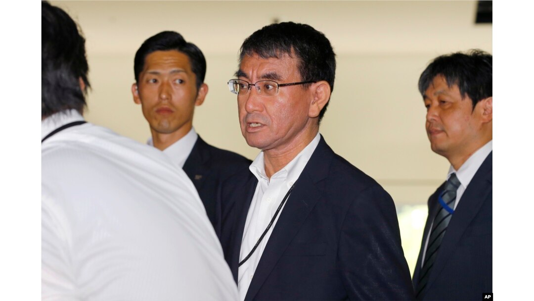 Japan's new Foreign Minister Taro Kono, center, leaves the prime minister's official residence in Tokyo, Aug. 3, 2017.