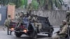 Waasi wa M23 wakifanya doria katika mitaa ya mji wa Goma, Januari 29.