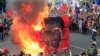 Protesters burn a cube effigy with a face of President Rodrigo Duterte during a National Day of Protest outside the presidential palace in metro Manila, Philippines Sept. 21, 2017. 