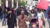A few hundred protesters looping the plaza and chanting "all night all day we want justice for Freddie Gray," in Baltimore, Maryland, April 23, 2015 (VOA / V. Macchi) 
