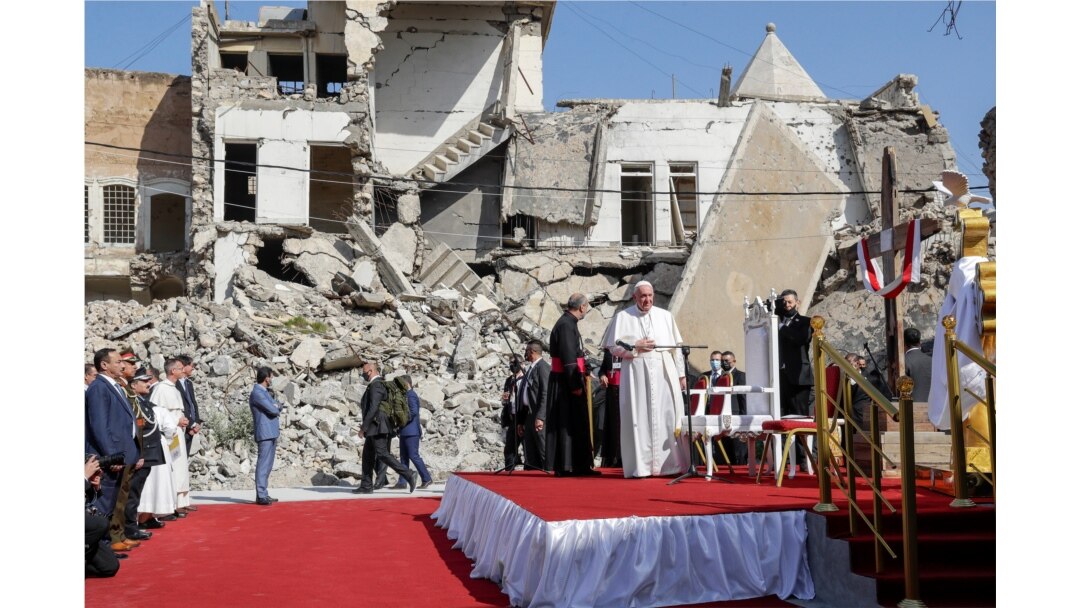 Pope Francis, surrounded by shells of destroyed churches, arrives to pray for the victims of war at Hosh al-Bieaa Church Square, in Mosul, Iraq, once the de-facto capital of IS, March 7, 2021.