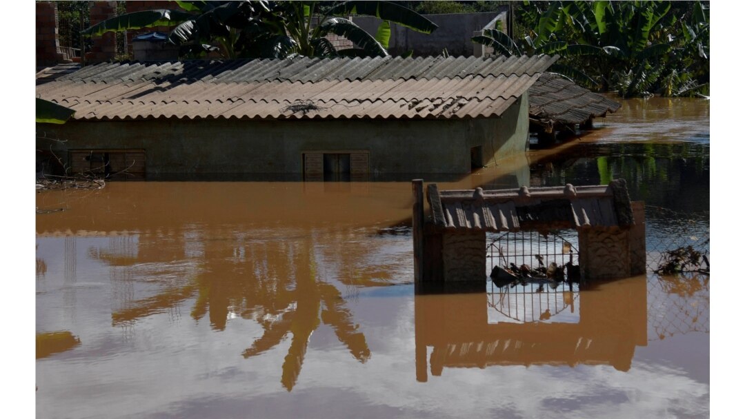 A house is seen at a flooded area after pouring rains in Mario Campos, in Minas Gerais state, Brazil, Jan. 12, 2022.