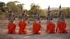 FILE - A screenshot from an Islamic State propaganda video purports to show young boys executing a group of captives.