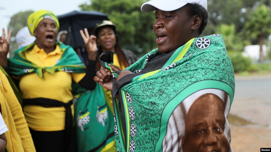 Supporters of South African President Cyril Ramaphosa sing and dance ahead of his arrival at the African National Congress (ANC) National Executive Committee meeting in Johannesburg, South Africa, Dec. 5, 2022.