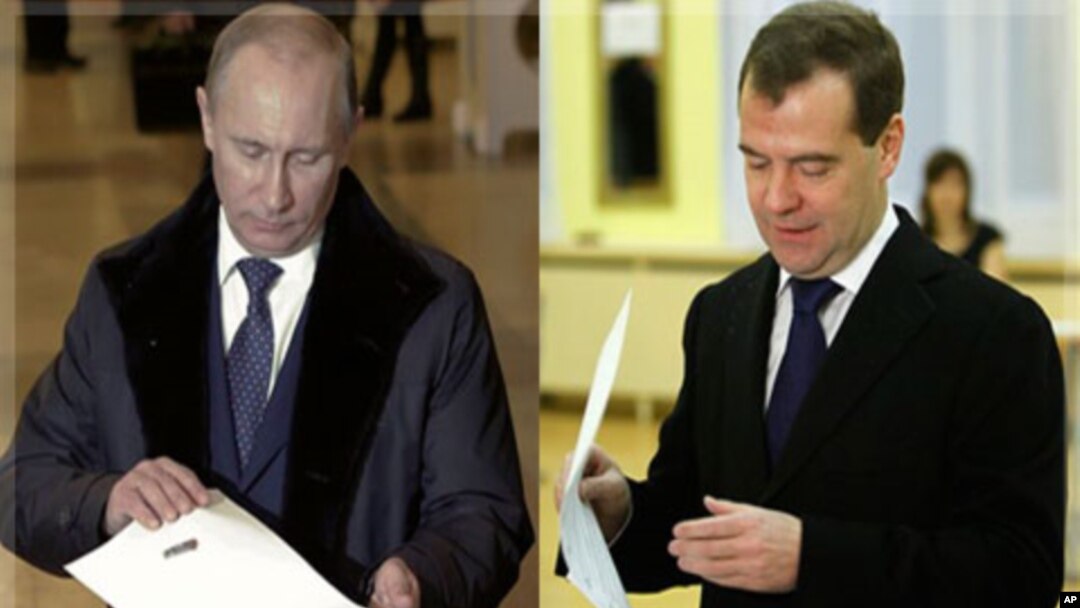 Russian Prime Minister Vladimir Putin, and Russian President Dmitry Medvedev cast their ballots in Moscow, December 4, 2011.
