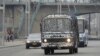 A bus covered in a net-like object drives on a street in Pyongyang, North Korea, in this photo taken by Kyodo, March 6, 2013. 