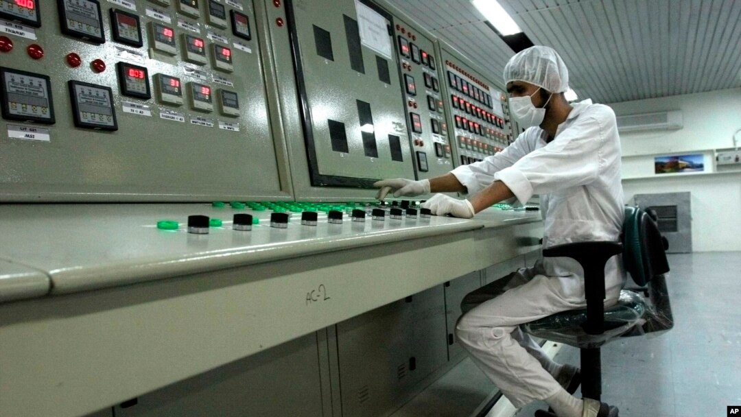 FILE - An Iranian technician works at a uranium conversion facility outside the city of Isfahan, Iran.