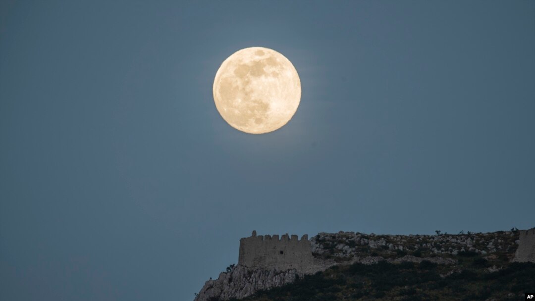 The moon rises above the castle of Acrocorinth, the acropolis of ancient Corinth, about 80 kilometers southwest of Athens on May 6, 2020.