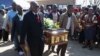 Mourners carry the casket of Andries Motlapula Ntsenyeho, one of the 34 striking platinum mineworkers shot dead at Lonmin's Marikana mine, at his home town of Sasolburg in South Africa's Free State province, September 1, 2012.