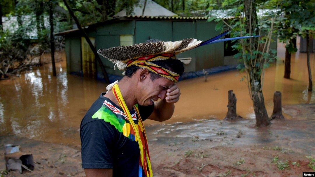 Indigenous leader Vice Cacique Sucupira of the Pataxo ethnicity reacts as he observes flooding in Nao Xoha village after pouring rains, in Sao Joaquim de Bicas, Minas Gerais state, Brazil, Jan. 12, 2022. 
