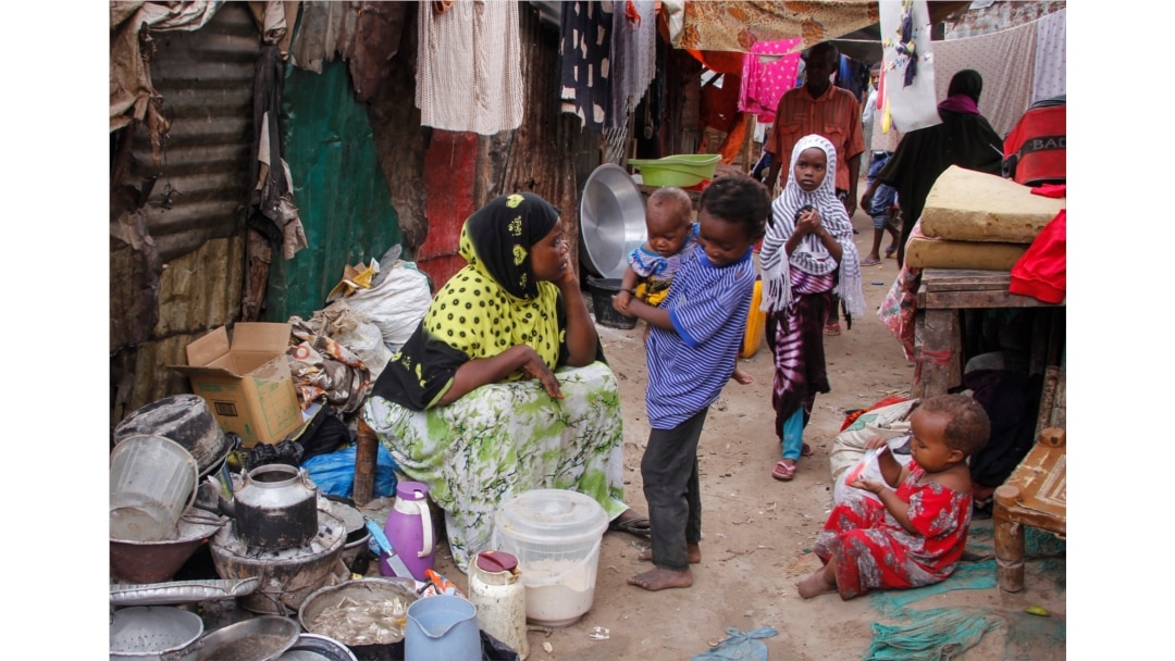 FILE - Residents live in crowded conditions in the Sayidka camp for internally displaced people in Mogadishu, Somalia, March 26, 2020.