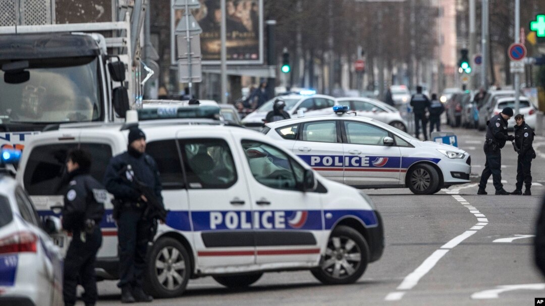 French police forces block a street during an operation in the Neudorf district of Strasbourg, eastern France, Thursday, Dec. 13, 2018.