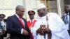 Ghana's President John Dramani Mahama (L) speaks with Gambia's President Yahya Jammeh (R) after a West African regional bloc ECOWAS summit on the crisis in Mali and Guinea Bissau, in Yamoussoukro, Ivory Coast, Feb. 27, 2013.