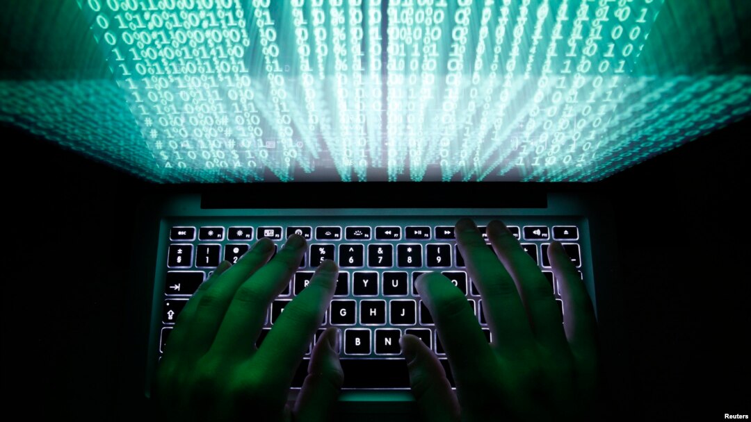 A man types on a computer keyboard in this illustration file picture. 