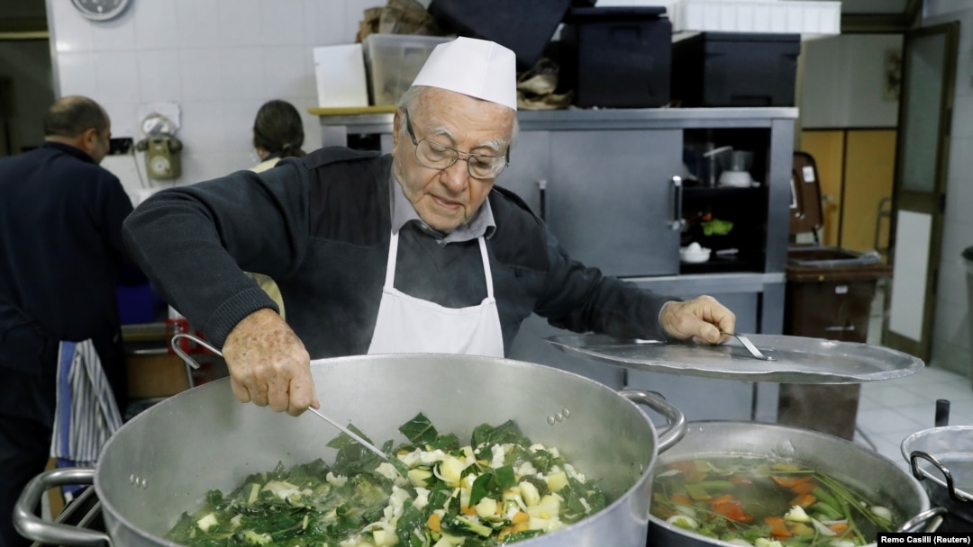 Dino Impagliazzo, Rome's 90-year-old 'chef of the poor', stirs a soup which he cooks for the homeless living in the city and outside the Vatican, in Rome, Italy, January 18, 2020