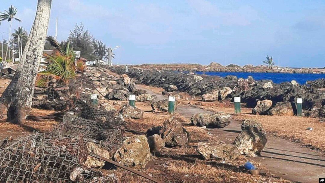 This photo provided by Broadcom Broadcasting shows a damaged area in Nuku’alofa, Tonga, Jan. 20, 2022, after Saturday's volcanic eruption near the Pacific archipelago. 