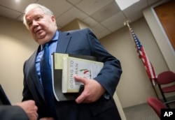 FILE - Russia's ambassador to the U.S., Sergey Kislyak, speaks with reporters in Washington.