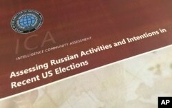 FILE - A part of the declassified version Intelligence Community Assessment on Russia's efforts to interfere with the U.S. political process is photographed in Washington, Jan. 6, 2017.