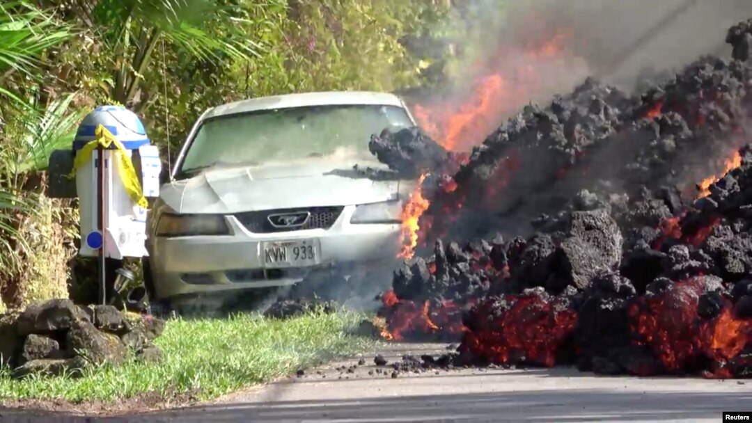 Lava engulfs a Ford Mustang in Puna, Hawaii, May 6, 2018.