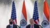 U.S. Secretary of State Mike Pompeo, right, speaks with Secretary of Defence Mark Esper seated beside him during a joint press conference with their Indian counterparts at Hyderabad House in New Delhi, India, Oct. 27, 2020.