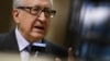 UN-Arab League peace envoy Lakhdar Brahimi gestures during a stakeout following a meeting with top US and Russian officials on the Syrian conflict at the United Nations office in Geneva, January 11, 2013.