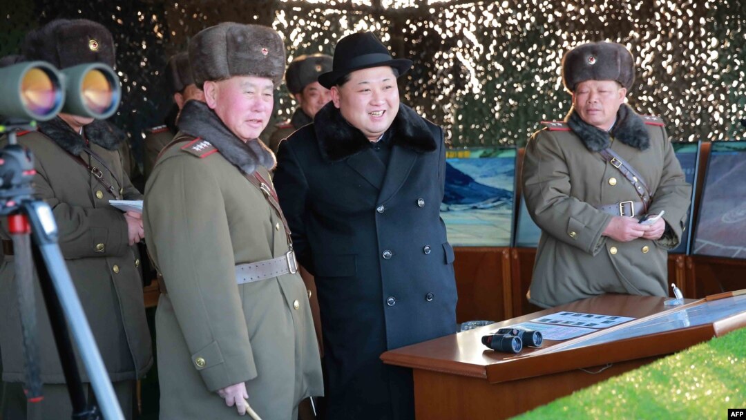 Undated photo released by North Korea's official Korean Central News Agency (KCNA) on Feb. 21, 2016 shows North Korean leader Kim Jong-Un (C) inspecting maneuvers for attack and defense between large combined units of the Korean People's Army (KPA).
