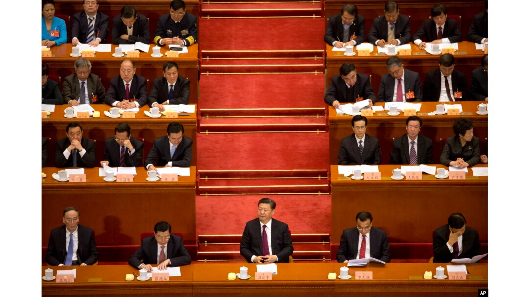 Chinese President Xi Jinping (center) listens during the opening session of the Chinese People's Political Consultative Conference in Beijing's Great Hall of the People, March 3, 2017. The head of China's legislative advisory body, Yu Zhengsheng, said China continues its firm opposition to Taiwan's formal independence and insistence that its leaders accept that the self-governing island is part of China.