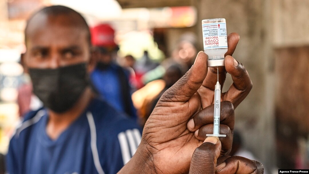 FILE - A health official prepares the Moderna Covid-19 vaccine during a mass Covid-19 vaccination drive in Nairobi, Kenya, Sep. 17, 2021.