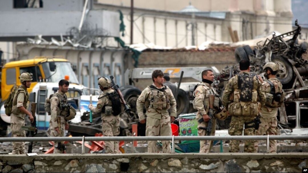 FILE - Afghan security forces inspect the site of a Taliban-claimed deadly suicide attack in Kabul, Afghanistan, April 19, 2016.