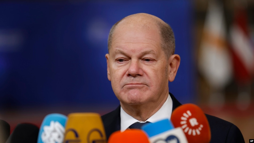 FILE - Germany's Chancellor Olaf Scholz speaks with the media as he arrives for an EU summit at the European Council building in Brussels, Dec. 19, 2024.