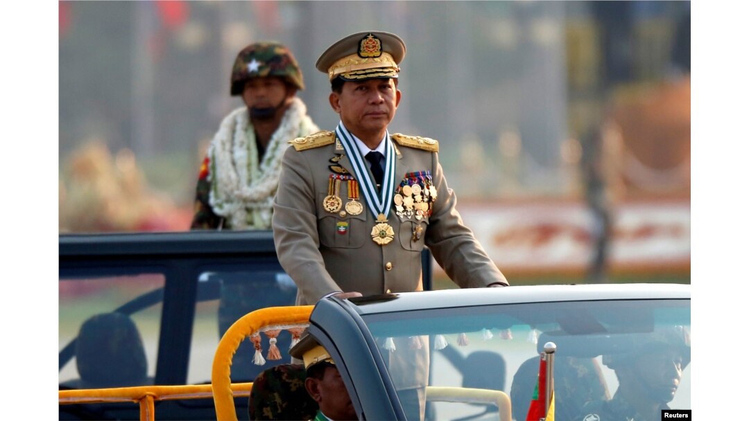 FILE - Myanmar's Senior General Min Aung Hlaing takes part during a parade to mark the 72nd Armed Forces Day in the capital Naypyitaw, Myanmar, March 27, 2017.